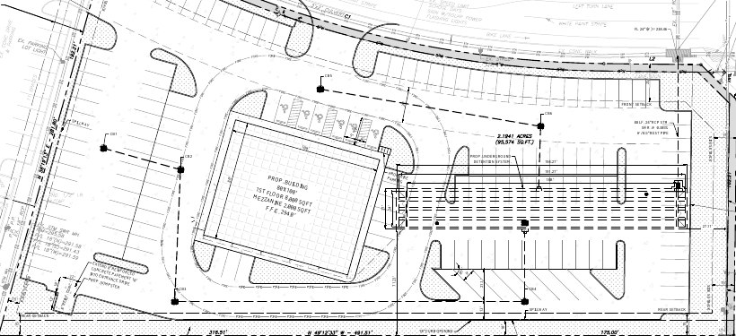 Redacted commercial site plan excerpt showing building and parking layout